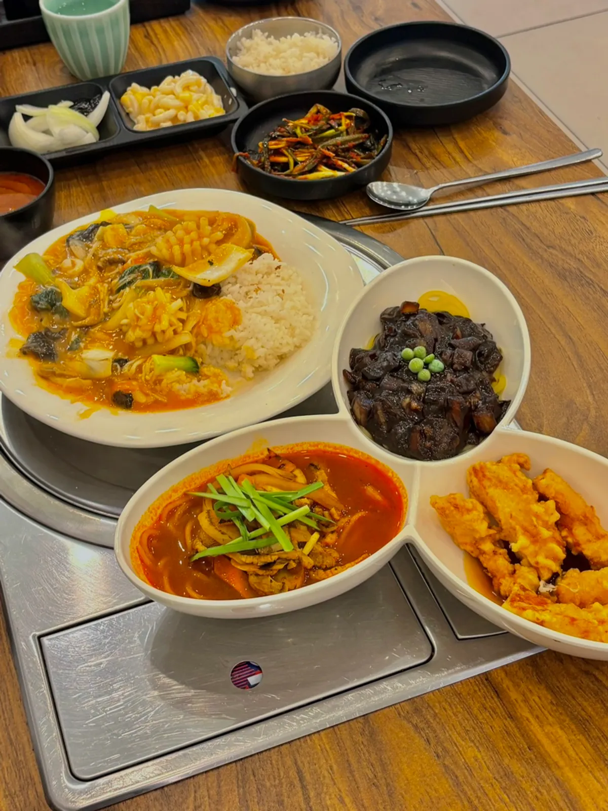 Table spread with Mayway's solo set meal and seafood rice bowl