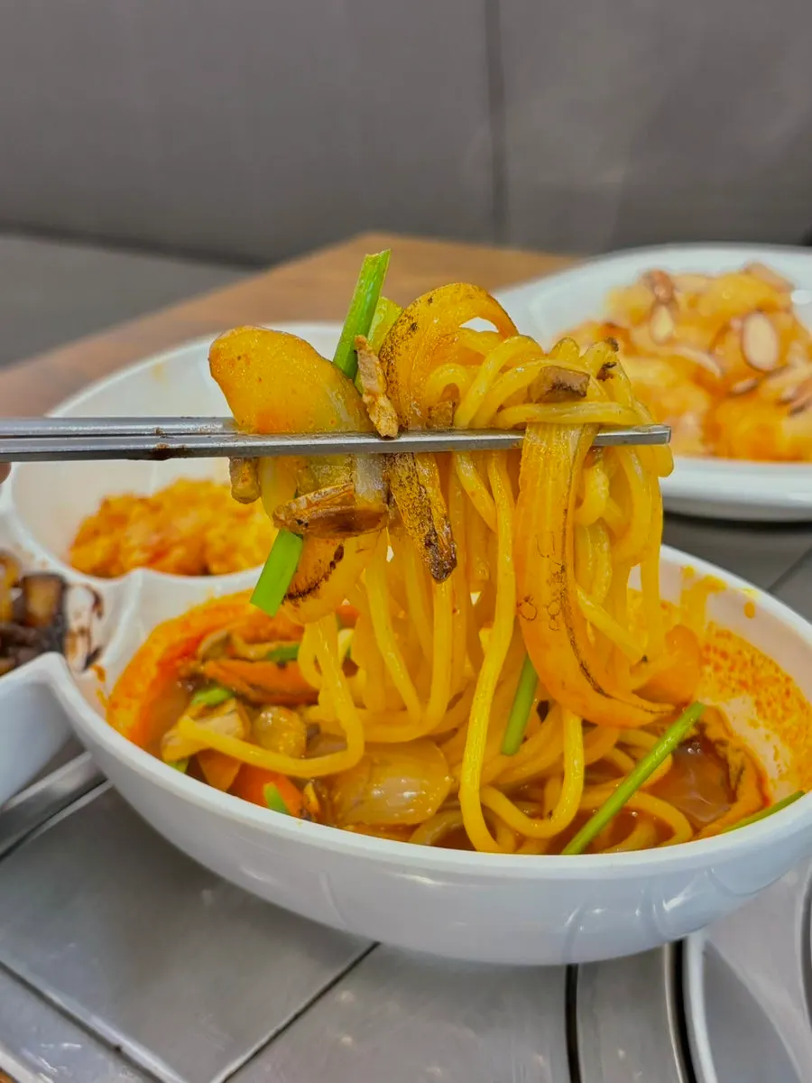 Picking up a piece of crispy tangsuyuk