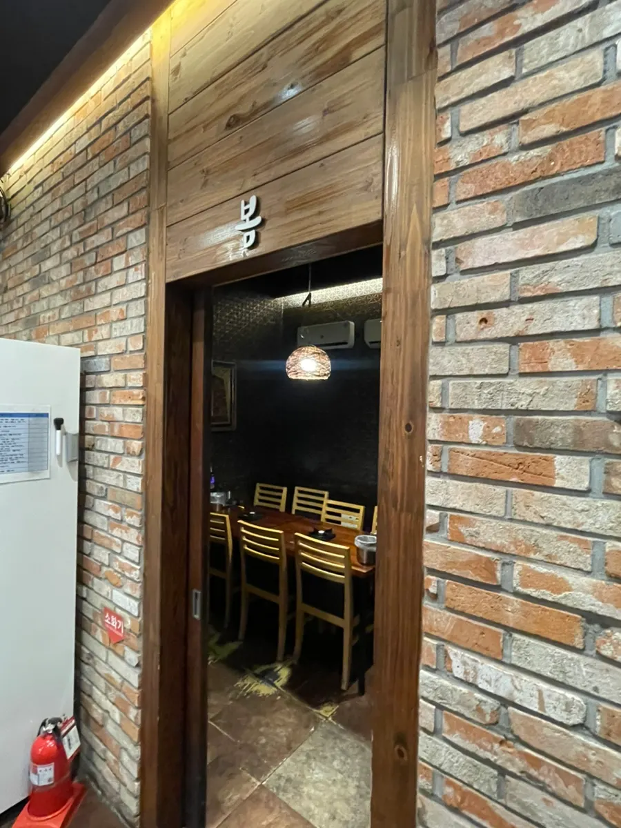 Interior decorated with wood tones and rattan lighting