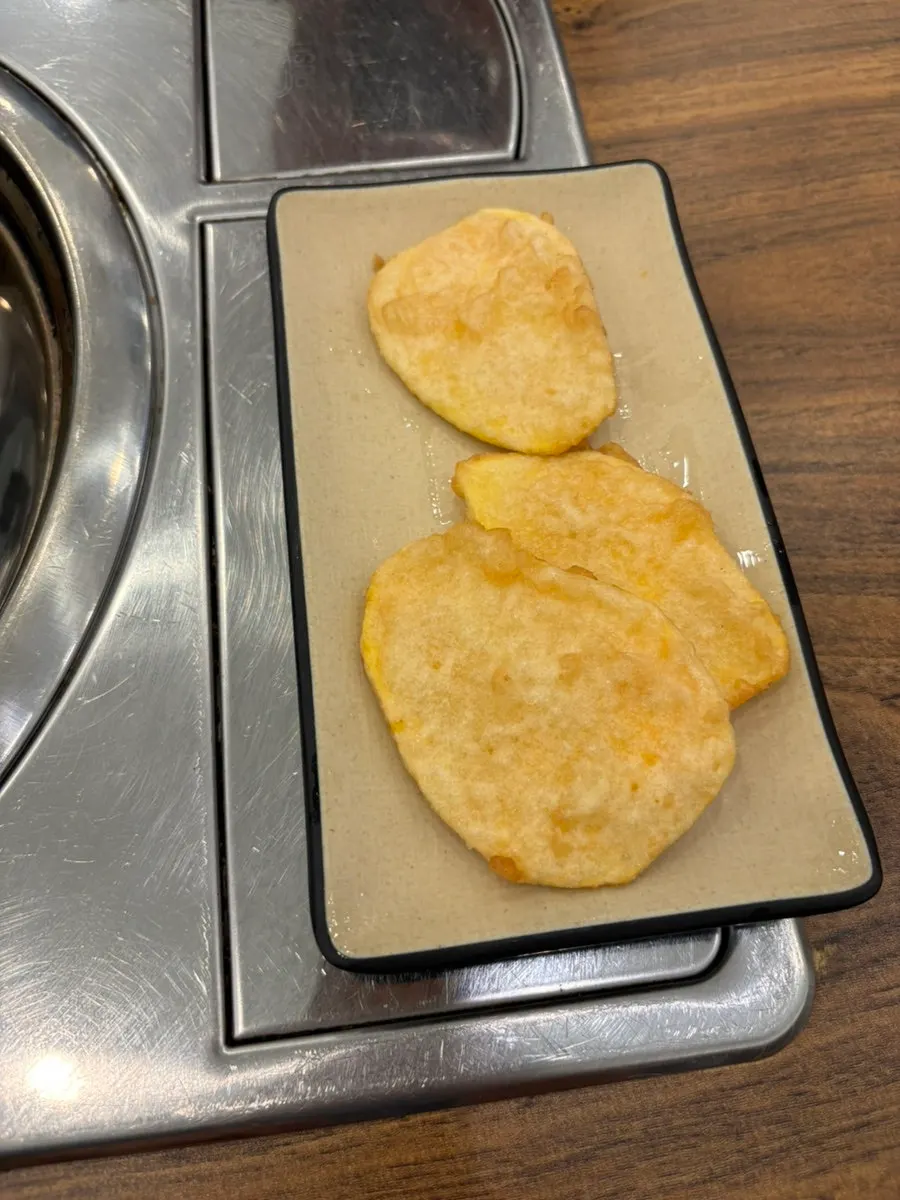 Complimentary sweet potato fritters served at the table