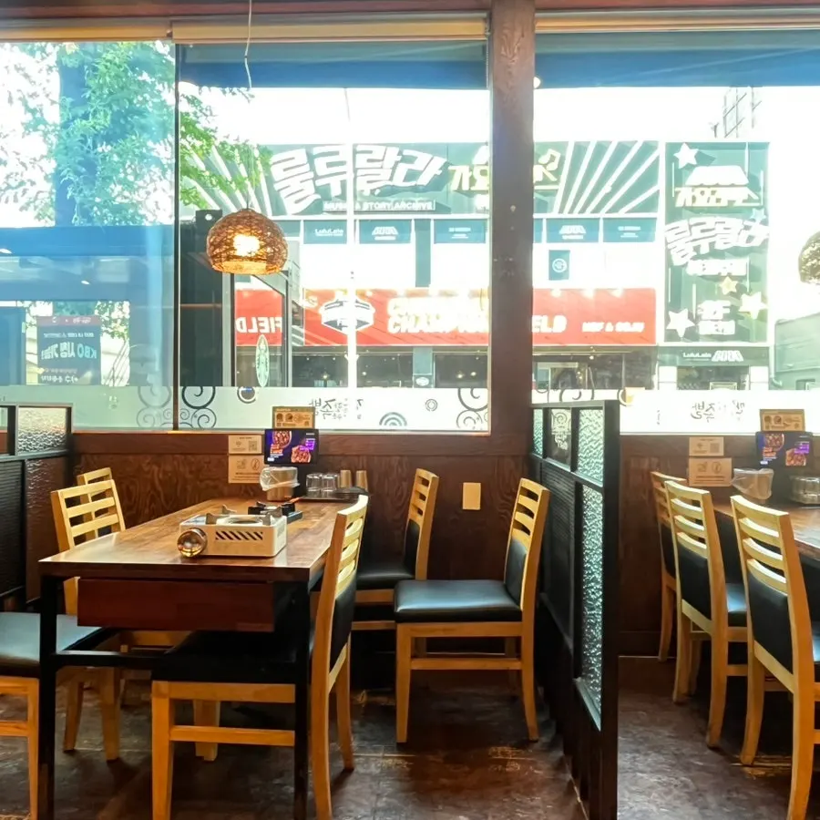 Restaurant exterior with floor-to-ceiling windows and signage