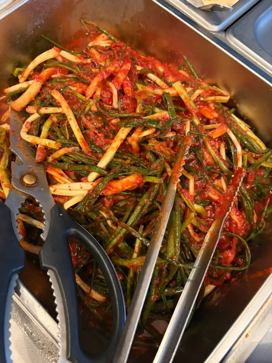 Thin sweet potato fritters served as an appetizer