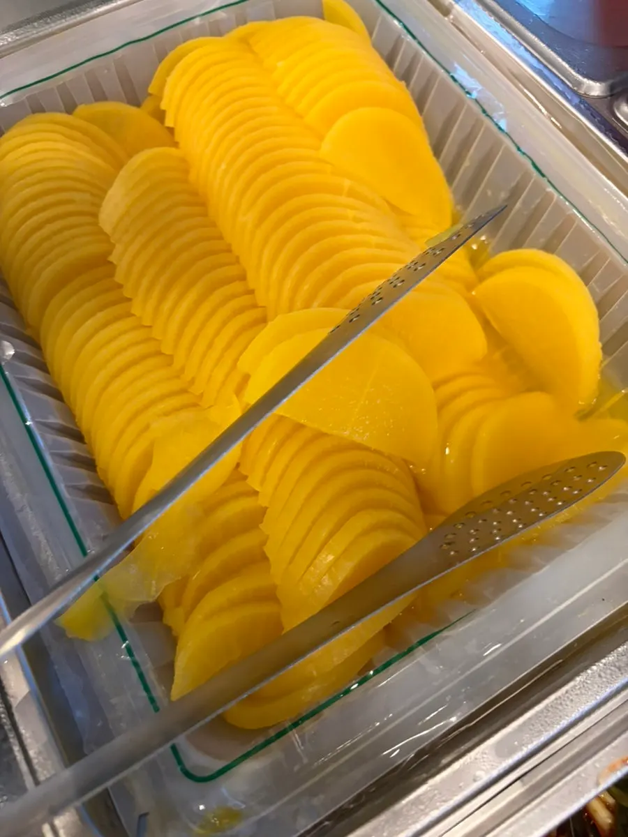 Thin sweet potato fritters served as an appetizer