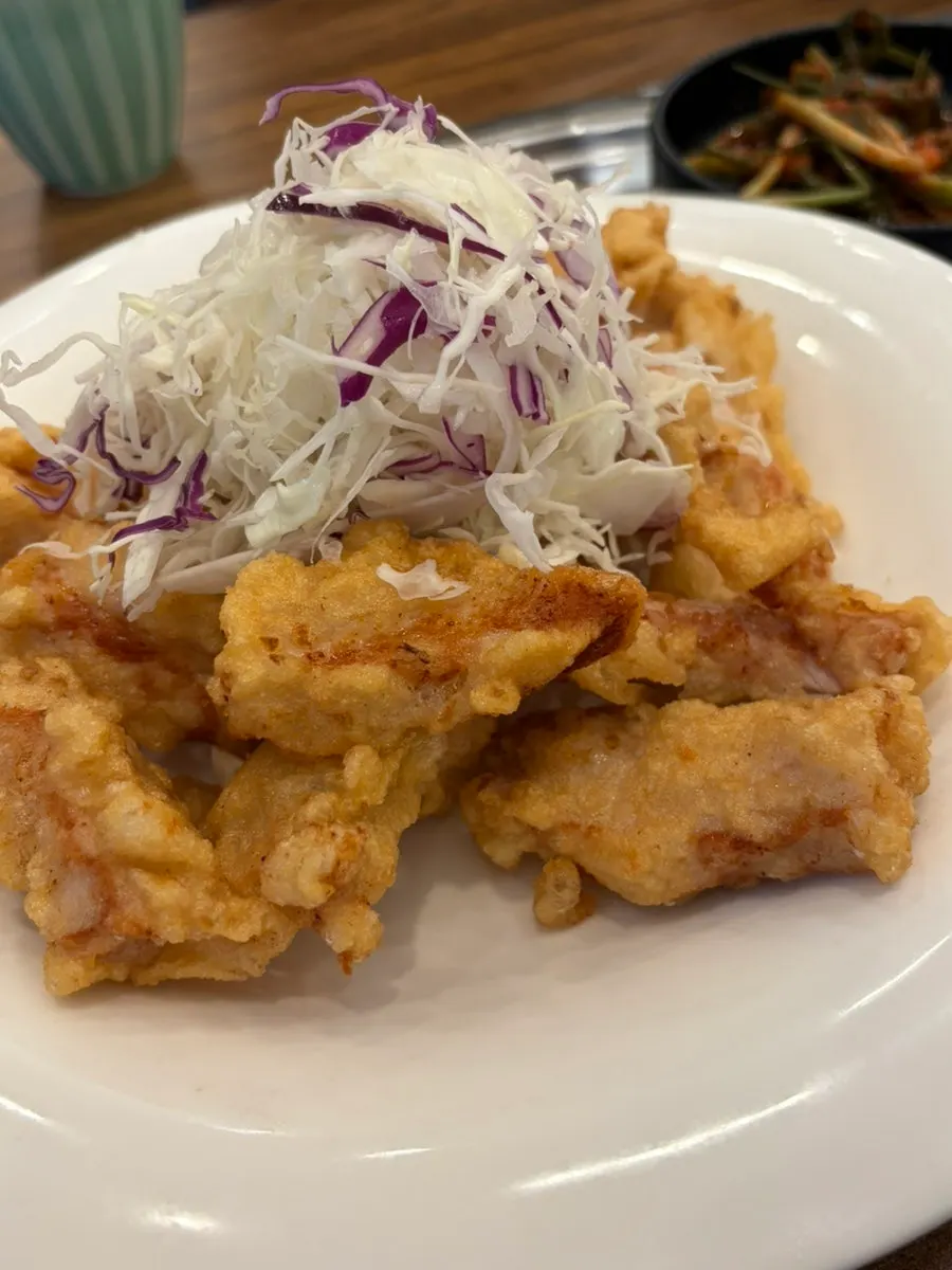 Self-service bar with macaroni salad and green onion kimchi