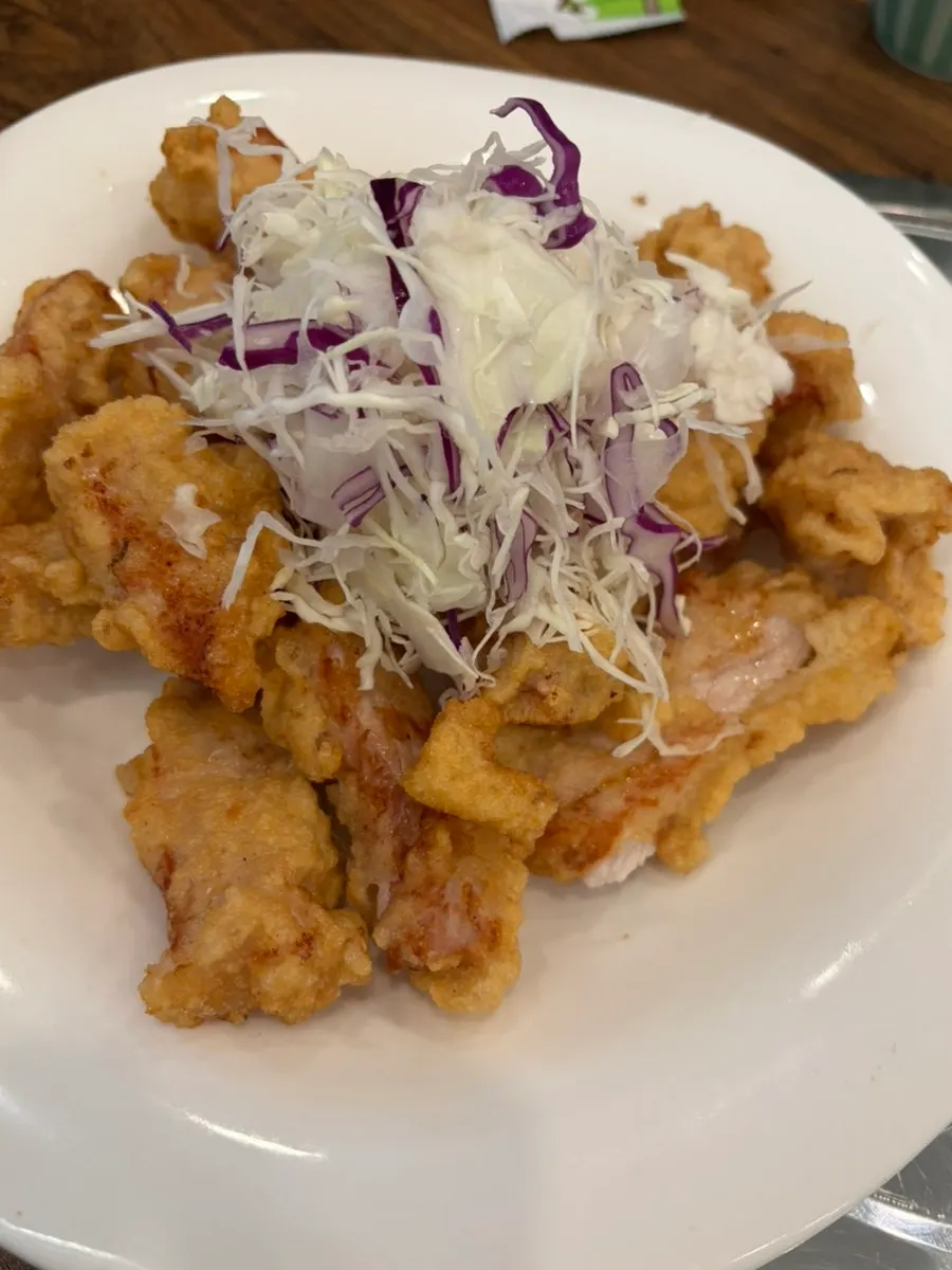 Self-service bar with macaroni salad and green onion kimchi