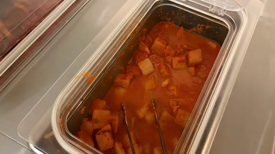 A plate of side dishes brought from the self-serve bar