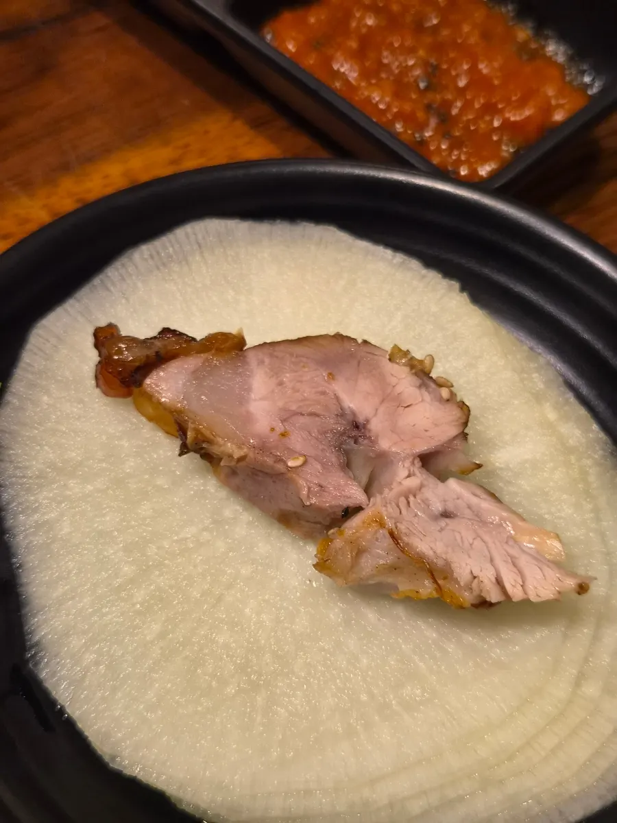 A piece of jokbal showing the chewy skin