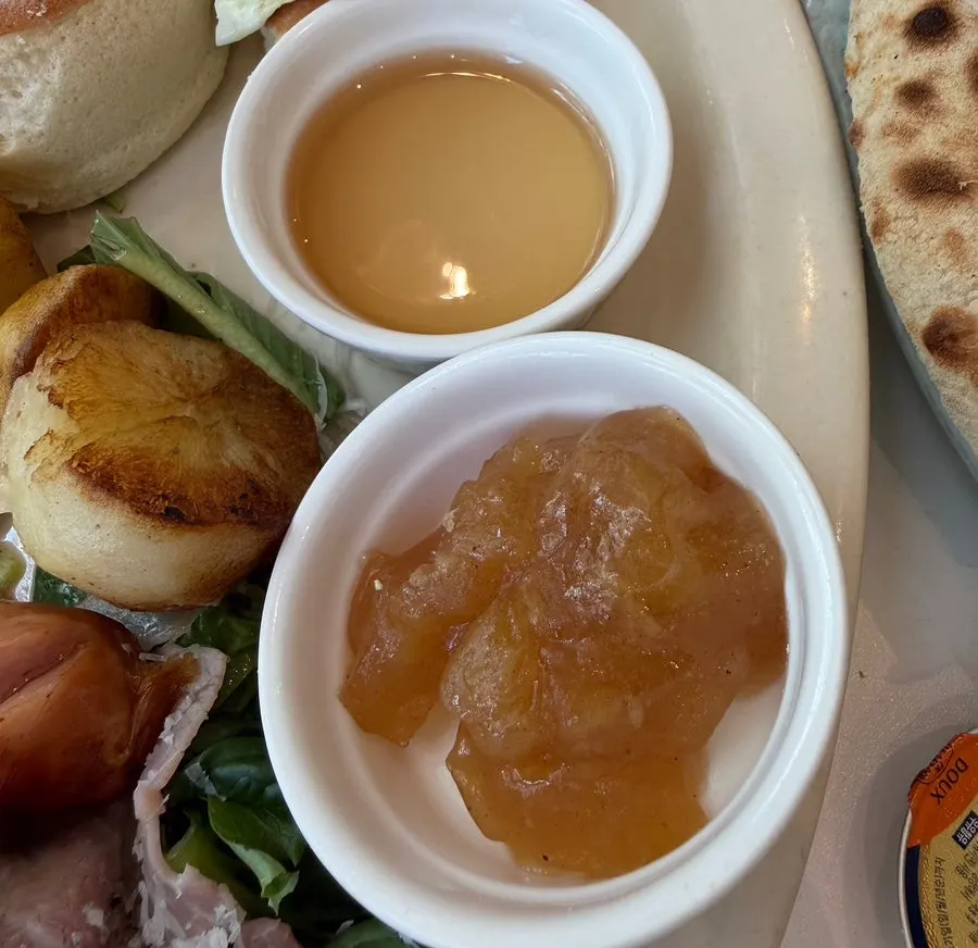Brunch plate with baby potatoes, sausage, and jambon salad