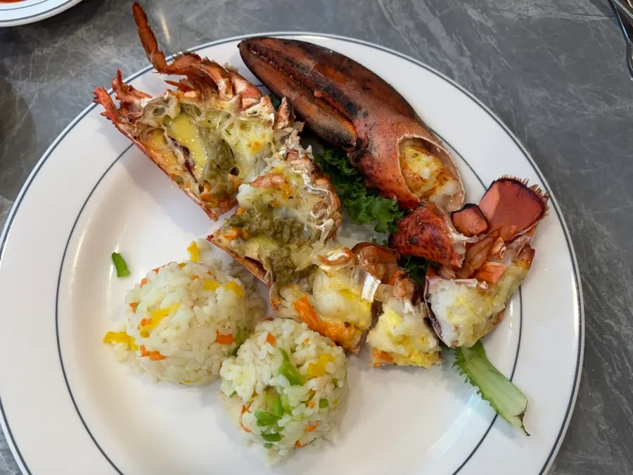 Lobster and fried rice plated individually