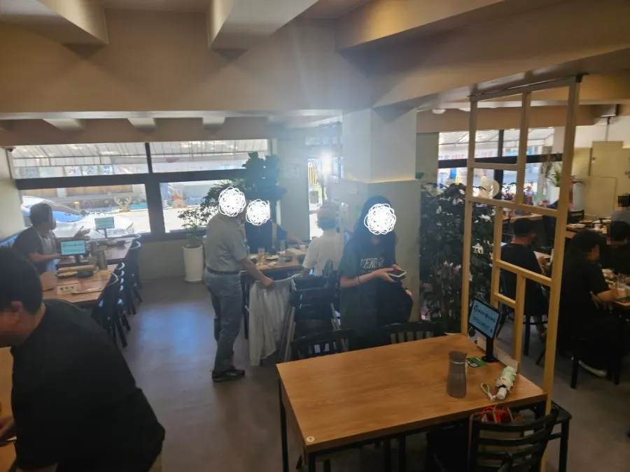 Restaurant interior packed with lunchtime customers