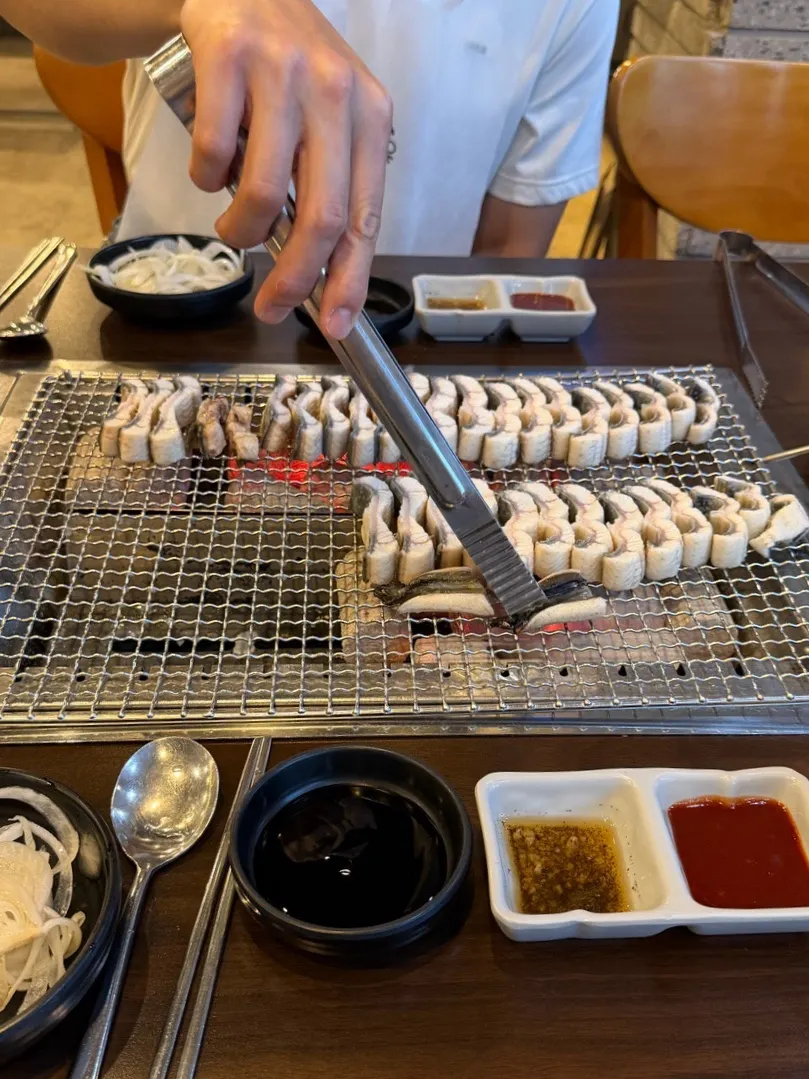 Thick grilled eel placed on the grill