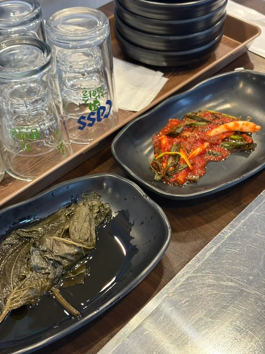 Basic side dish spread set out before the eel is grilled
