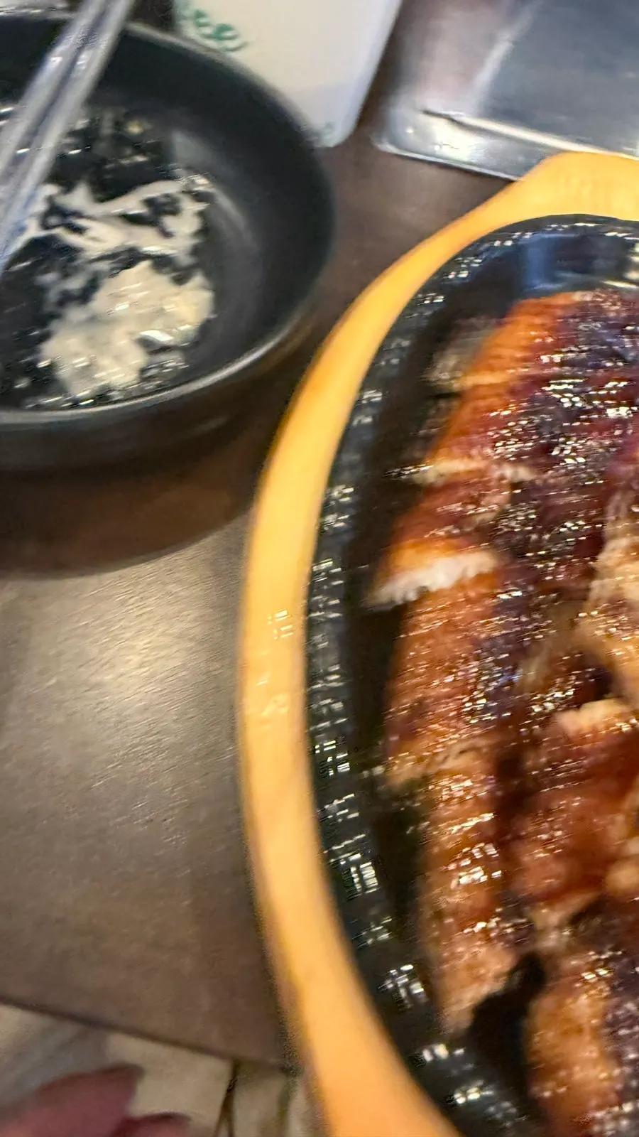 A spoonful of eel soup broth