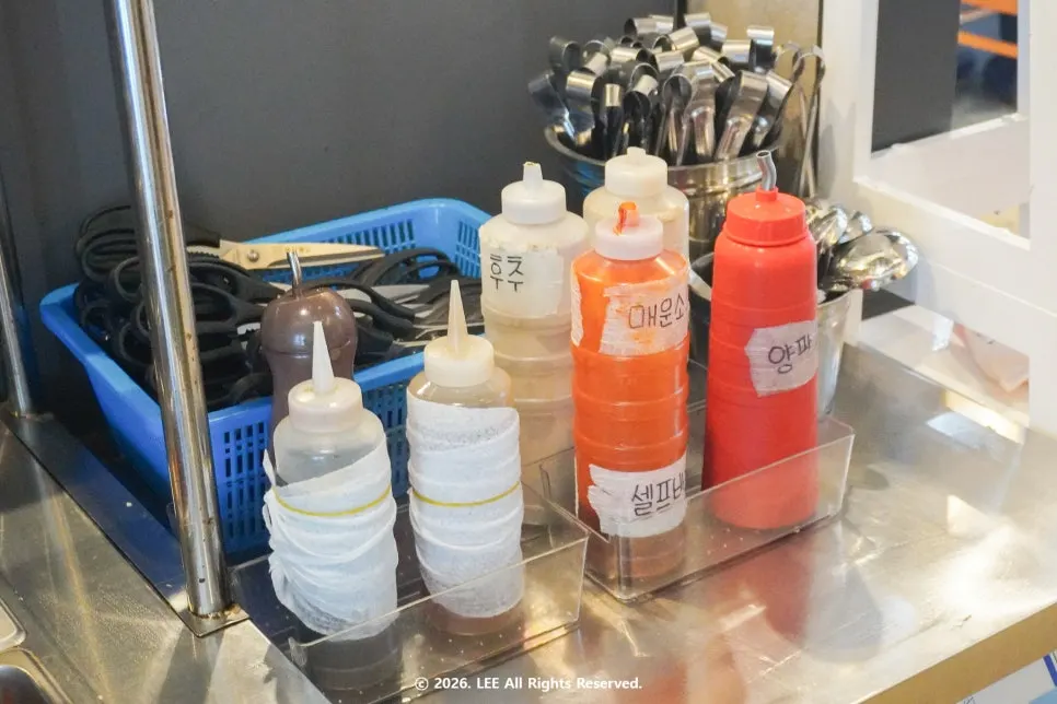 Pickled onion and sauces at the self-serve bar