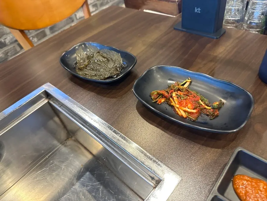 Self-serve bar with side dishes and sauces at Yuil Jangeo