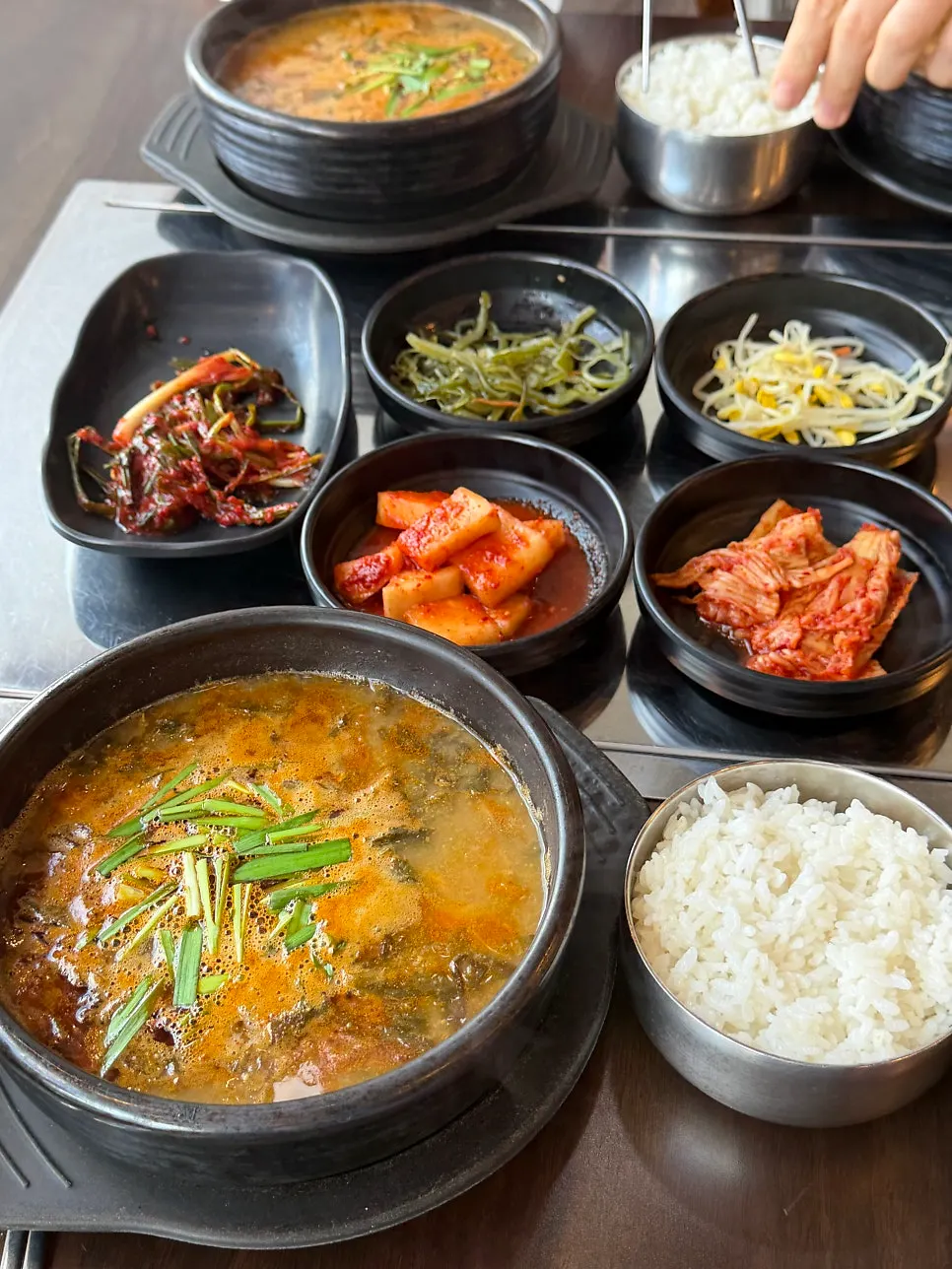 Broth showing thick, whole-cut pieces of eel