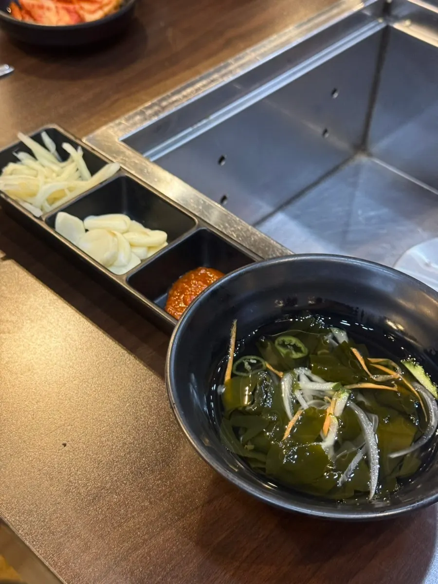 Side dishes including cold cucumber soup and bean sprouts