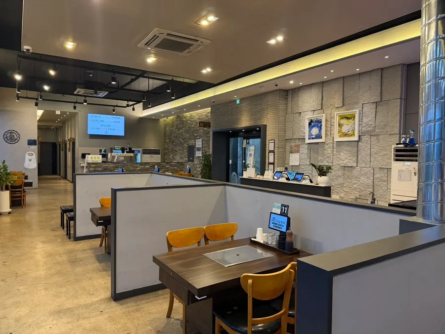 Spacious main hall at Yuil Jangeo with tables set well apart