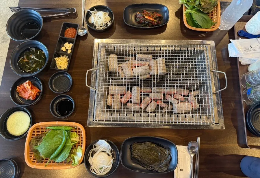 Table setting and side dishes before grilling begins