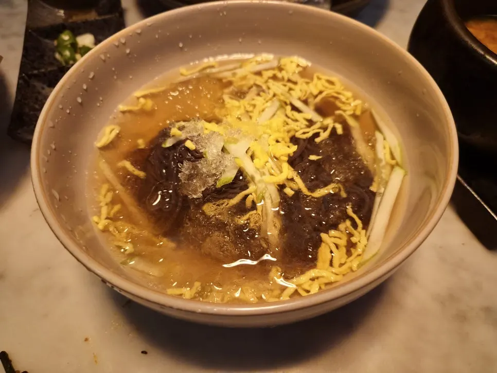 Mul-naengmyeon topped with tiny ice crystals