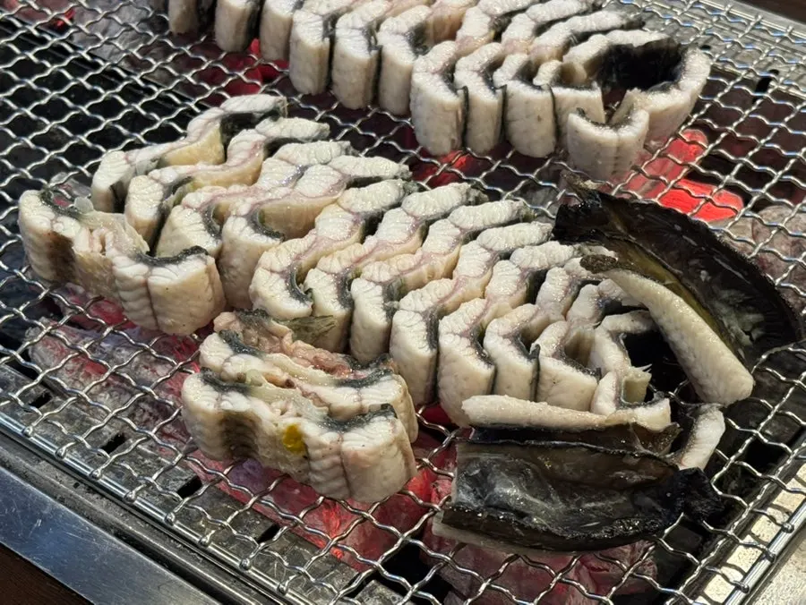 Eel cooking over charcoal