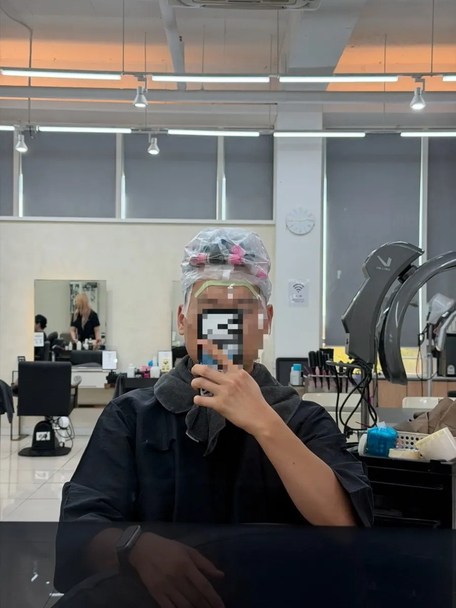 The ash perm treatment in progress