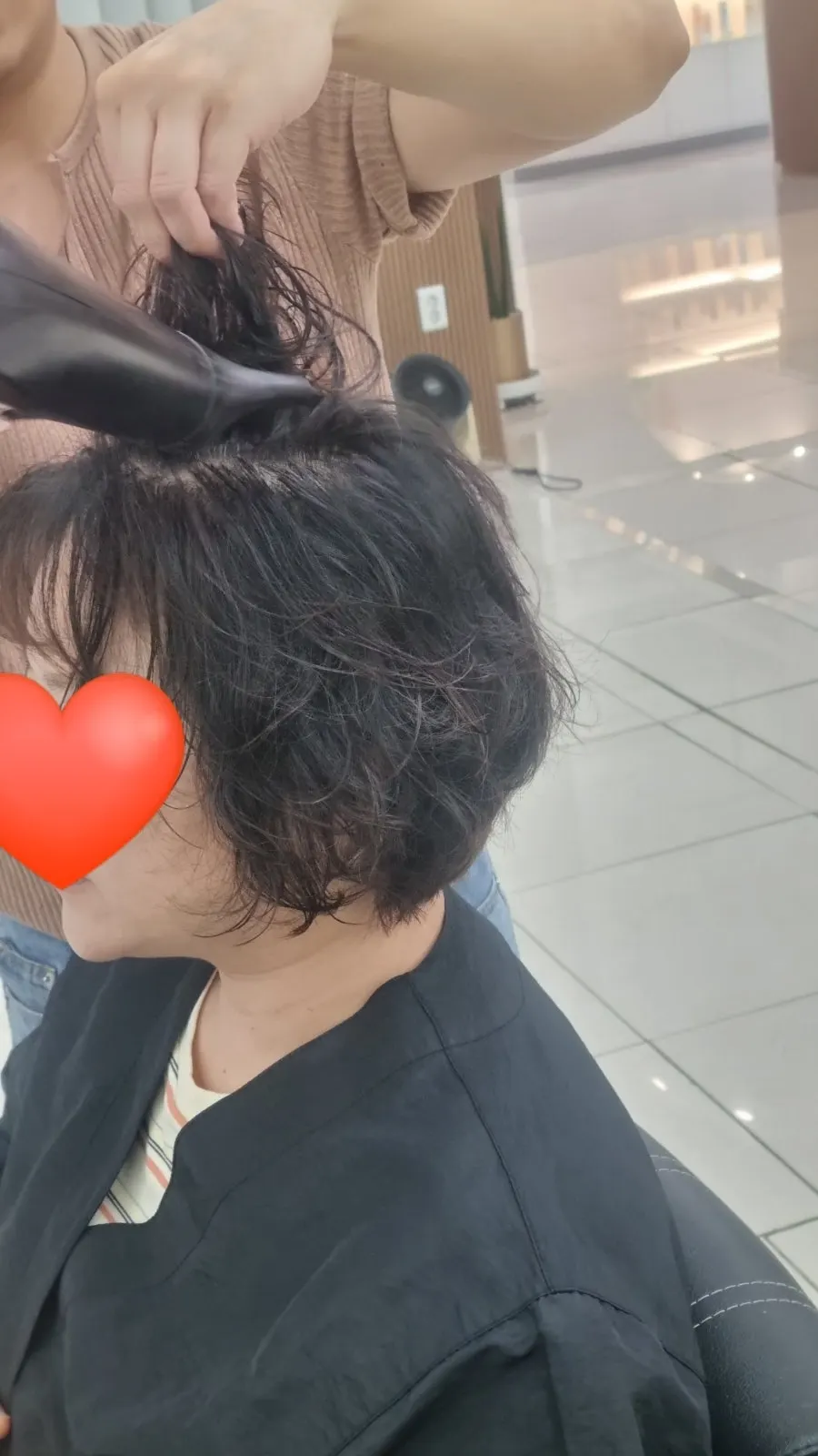 Finished perm style after styling guidance