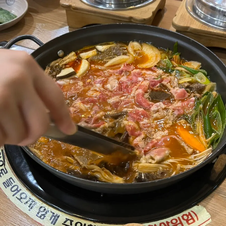 Usintang hot pot simmering with beef brisket added