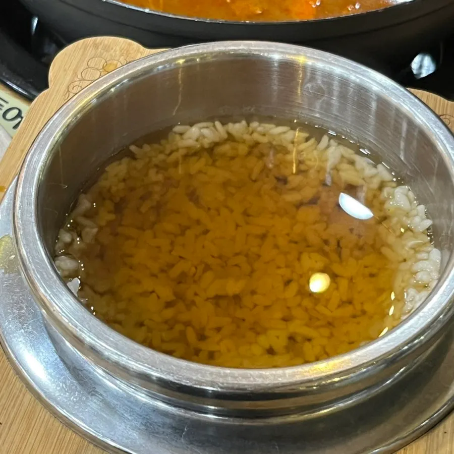 A spoonful with bracken fern and short ribs