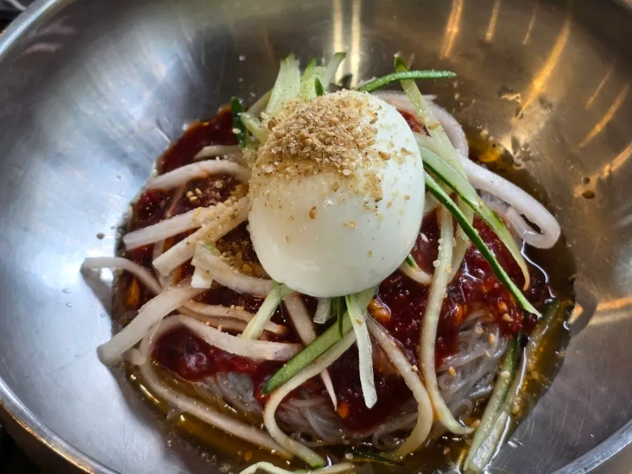 Table setting toward the end of the meal with galbi and naengmyeon