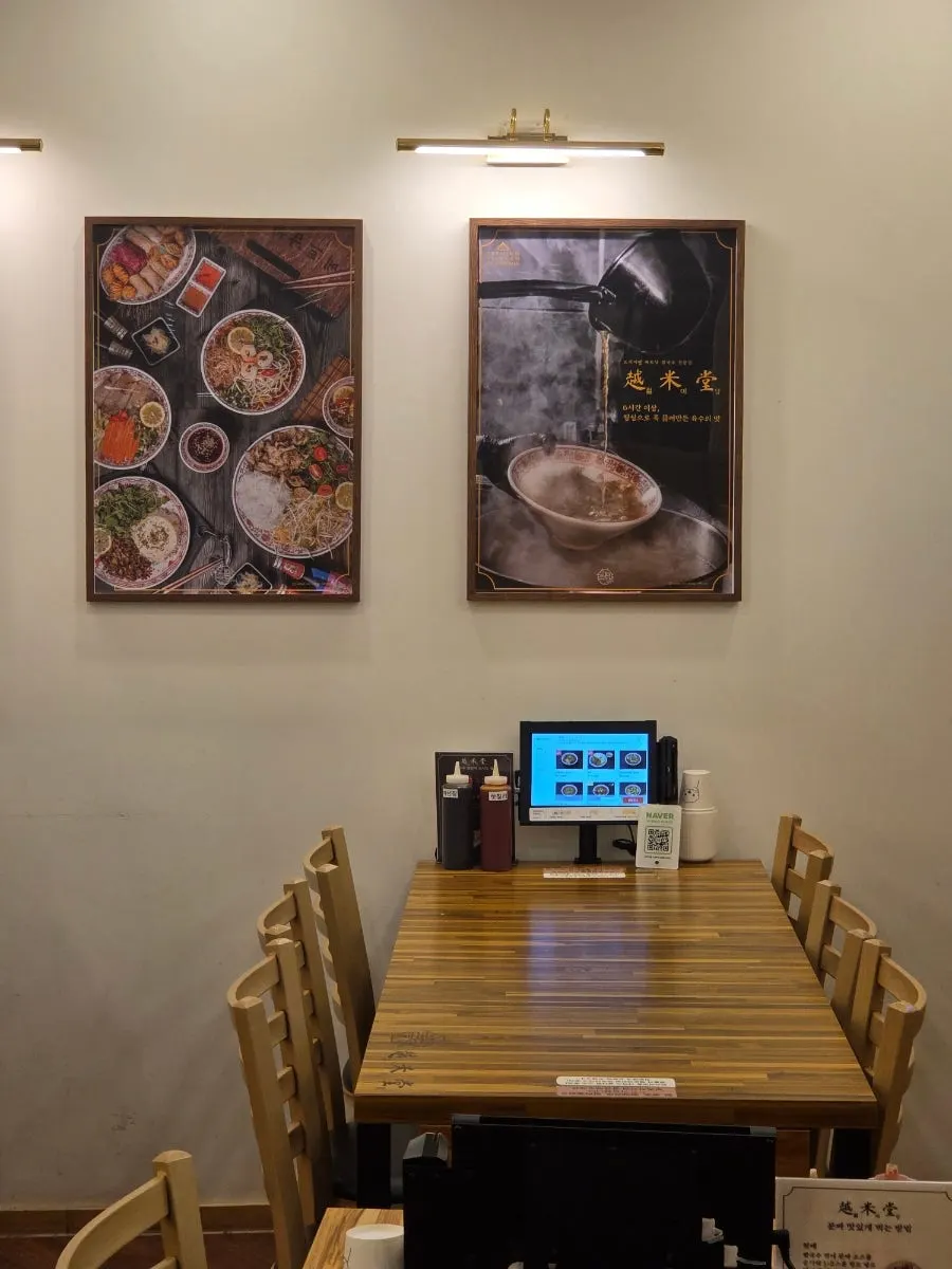 Generously spaced tables under bright lighting