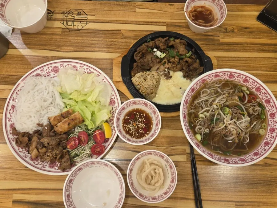 Pho, bún chả, and rice bowl served together at once