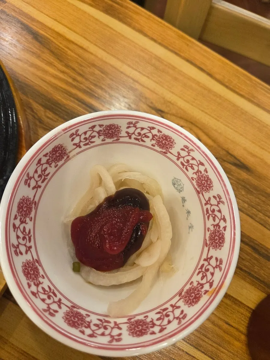 A mixed dipping sauce made for the pho