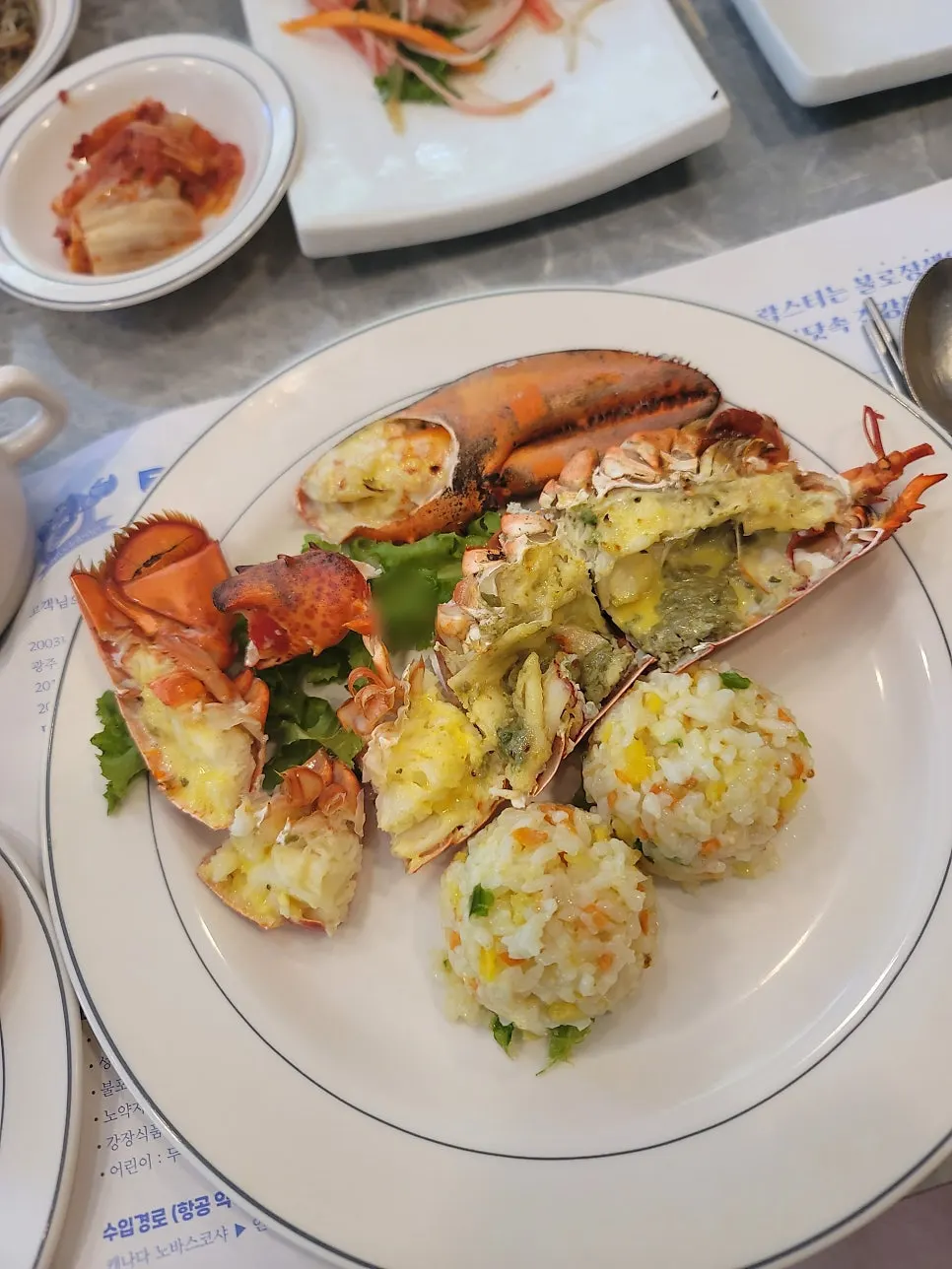 Main dish of half a seasoned grilled lobster