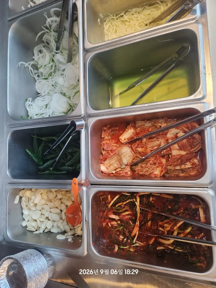 Self-serve side dish corner at Yuil Jangeo