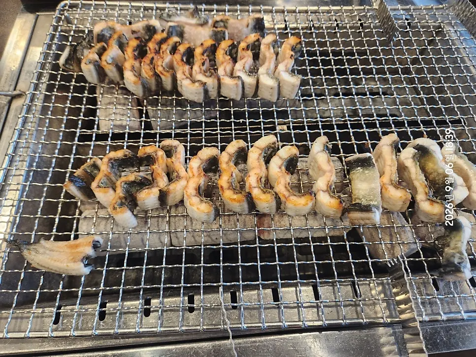 Eel grilling over charcoal