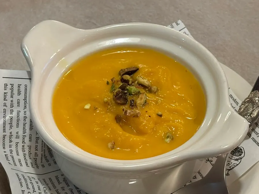 Sweet pumpkin soup in an individual soup cup