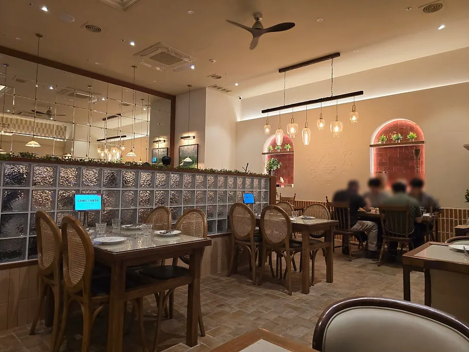 Camel Orzo's dining hall with wood-tone interior