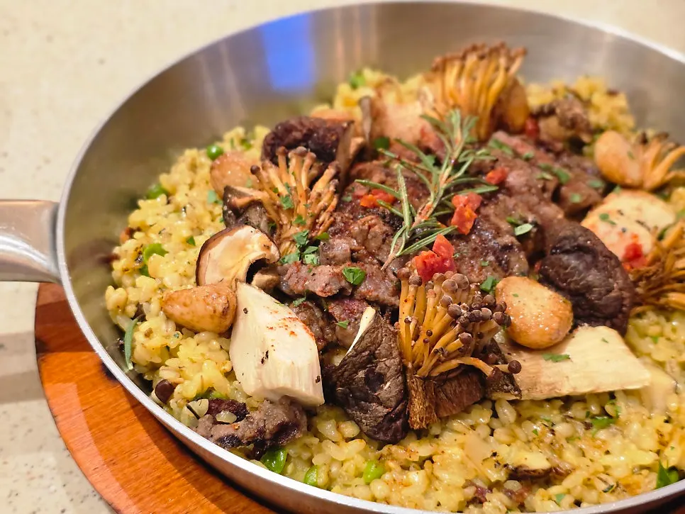 Paella rice colored bright yellow with saffron