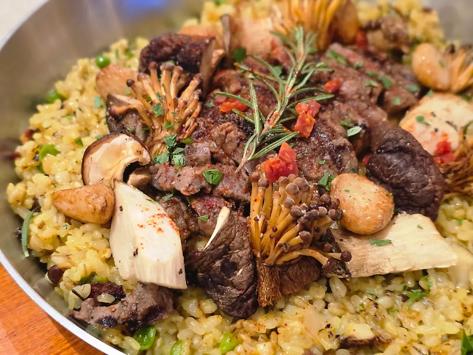 Close-up of paella mixed with pancetta