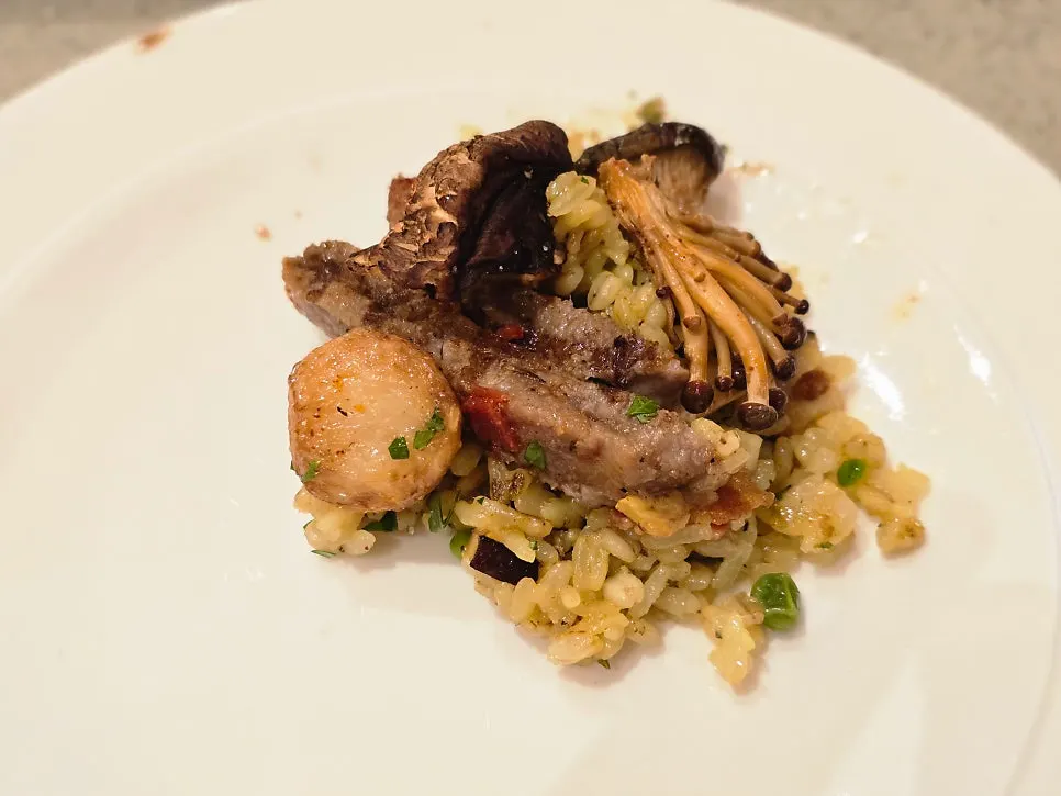 Paella mixed with peas and mushrooms