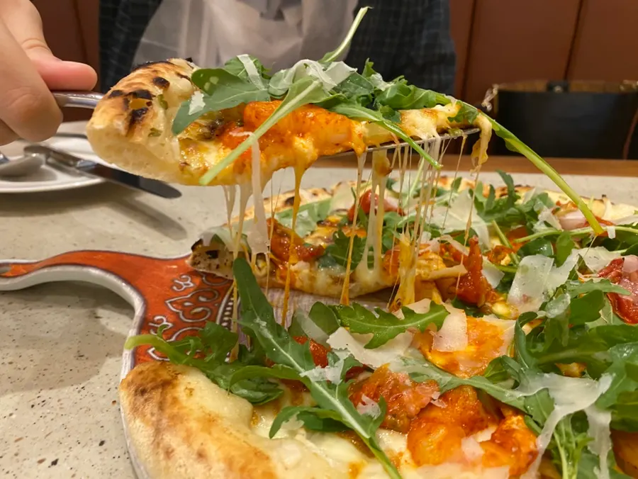 Pizza served on a plate with southern Italian styling