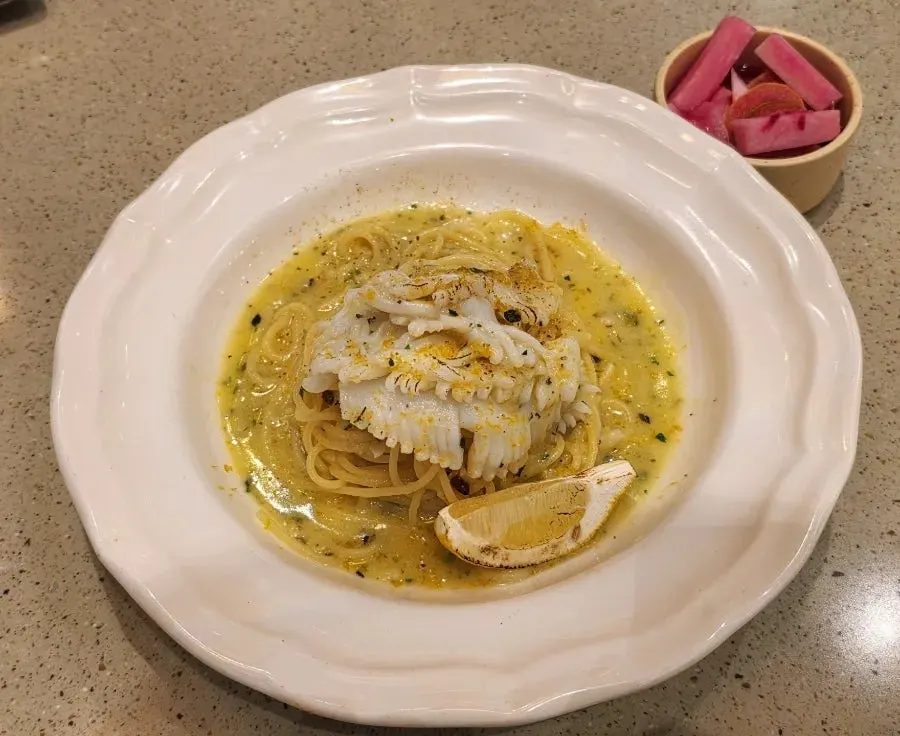 A plate of Bottarga cuttlefish aglio olio pasta