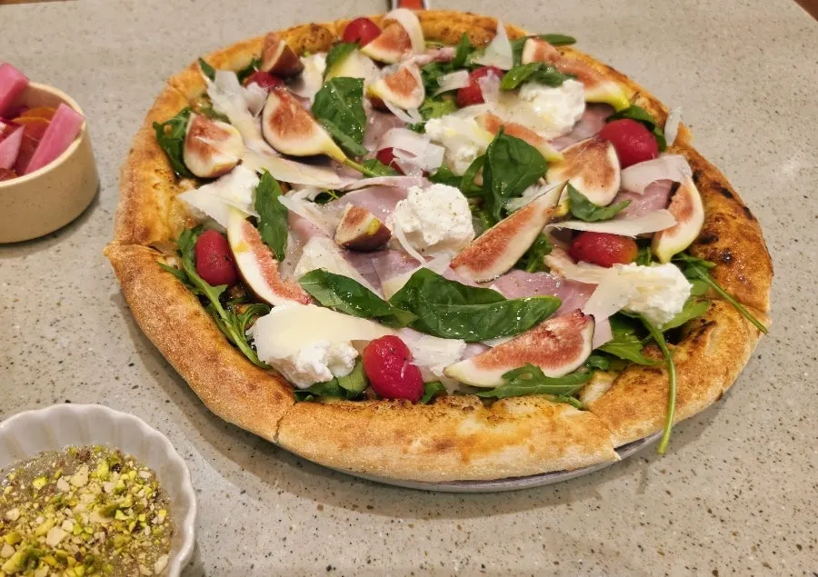 Fig Fresco wood-fired pizza with pistachio sauce