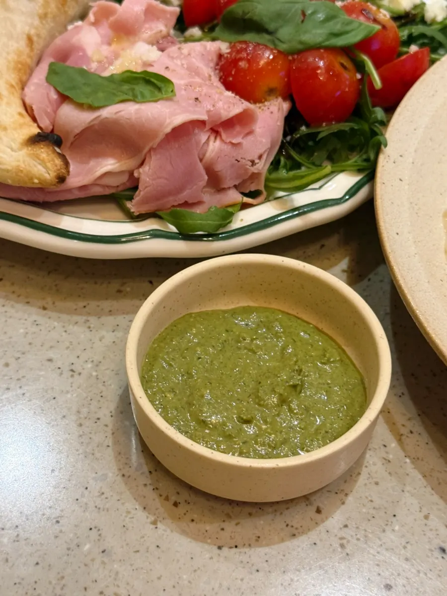 Extra basil pesto provided on the side