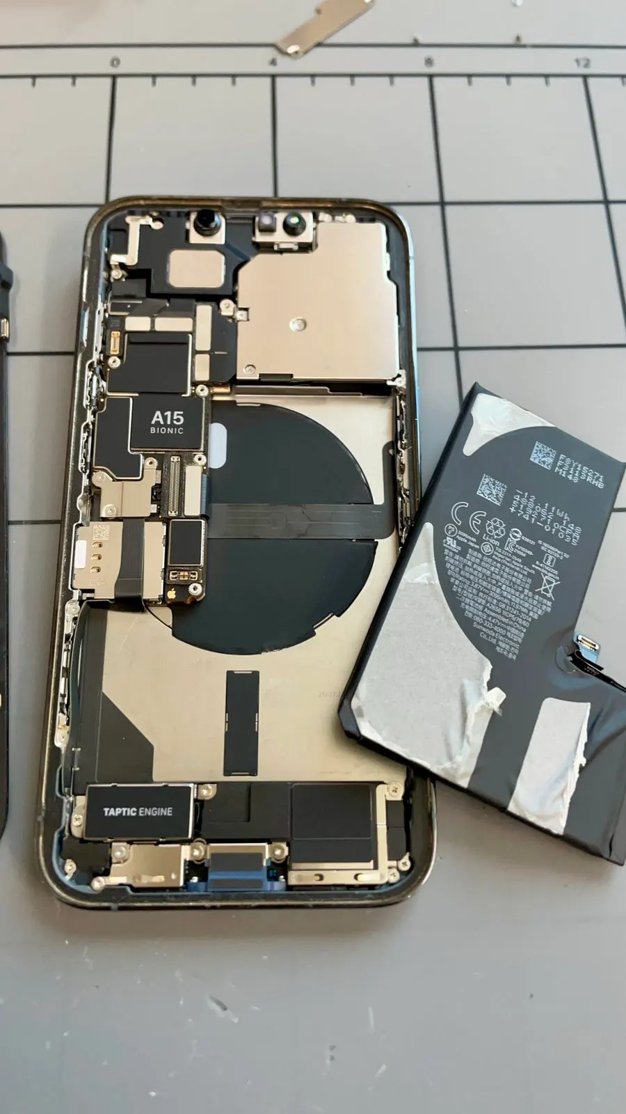 Inside the iPhone during the battery replacement process