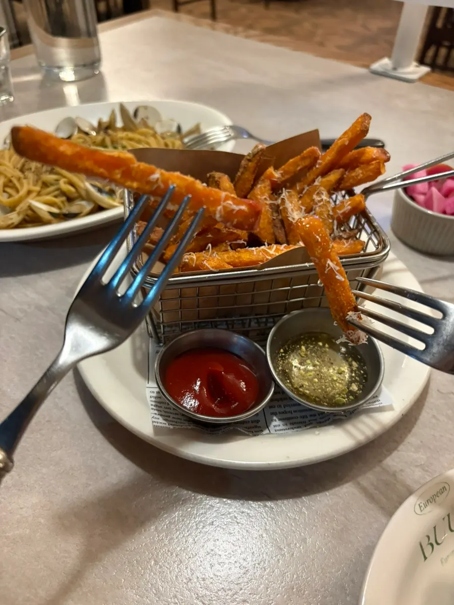 Close-up of sweet potato fries shaped like regular french fries