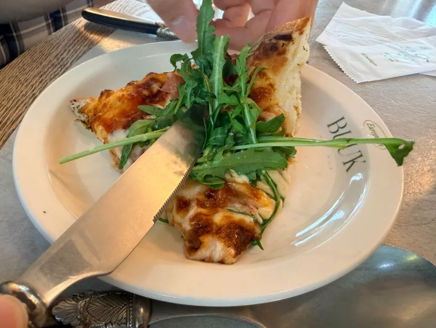 Cross-section of the lasagna showing rich cheese and sauce