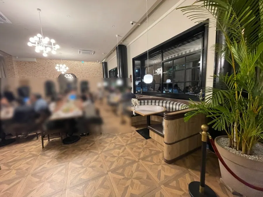 Wide view of the hall filled with group diners