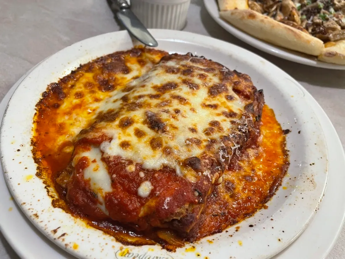 Plate of cheese-covered lasagna
